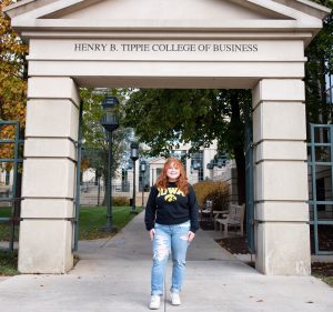Isabella Volfson standing under Tippie Arch