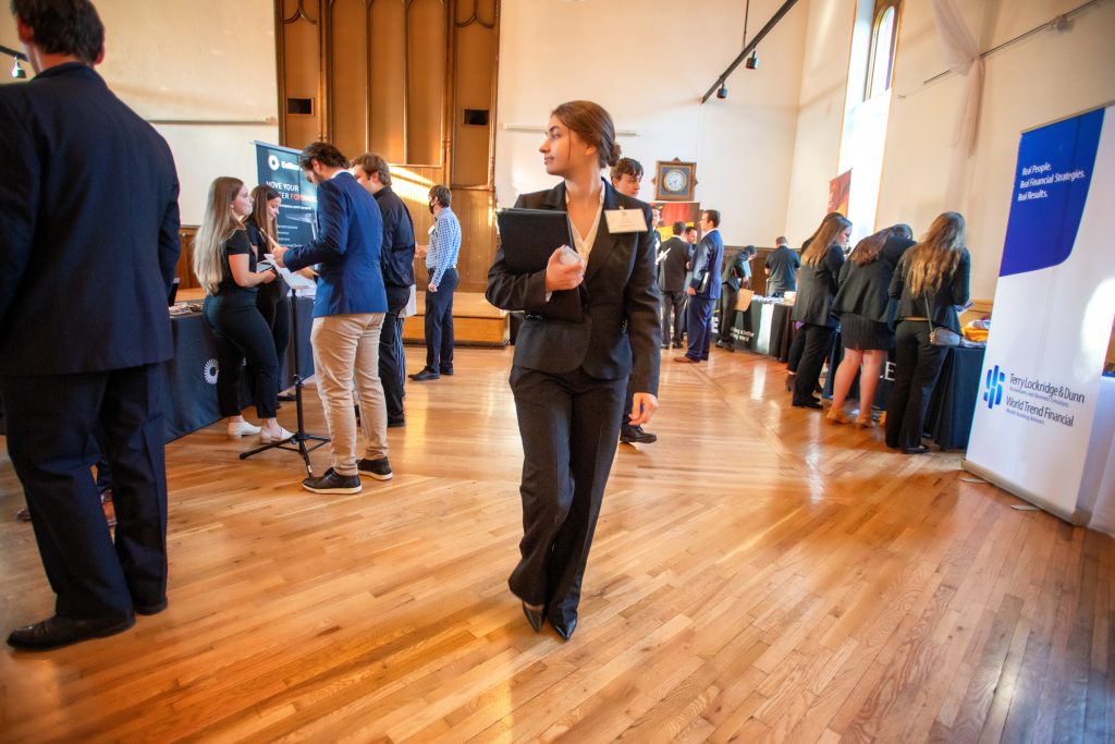 student in suit at career fair